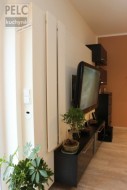 Řešení úložných prostor obývacího pokoje v propojení s designem.
